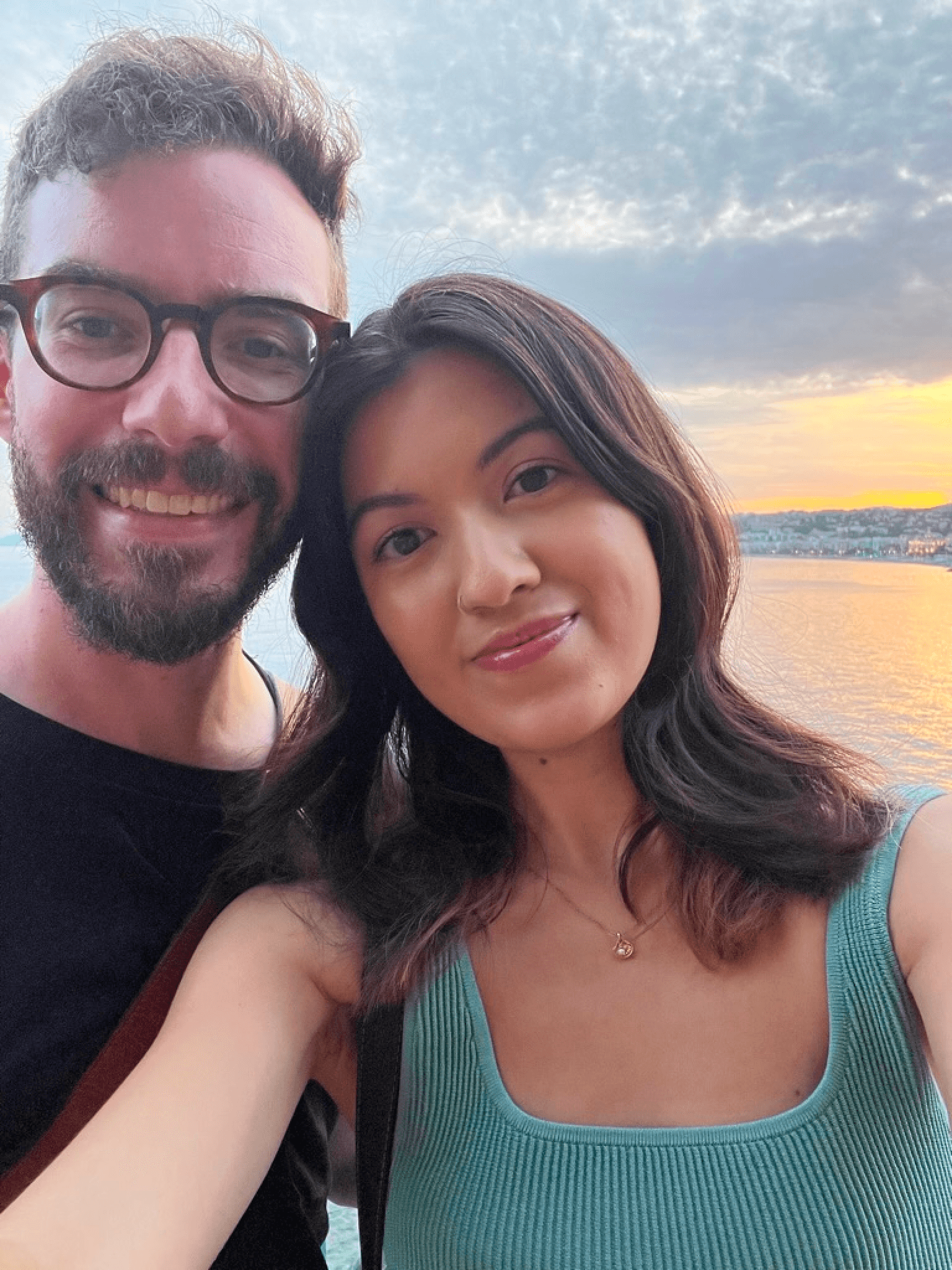 Delanie and Jonathan by a beach at sunset in Nice